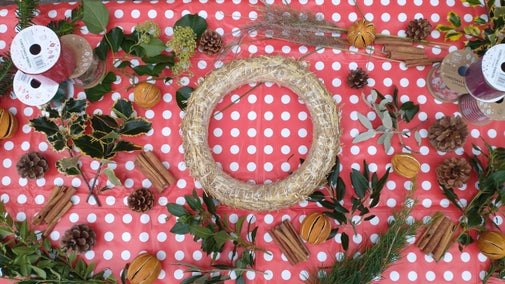 A table set out ready to create a seasonal wreath